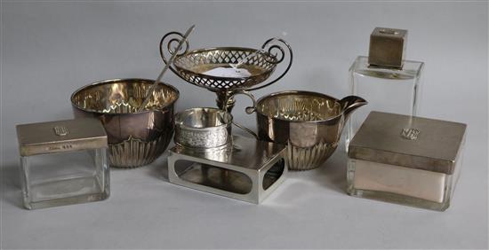 A quantity of assorted silver items including Asprey toilet jars, sugar bowl, cream jug and bonbon dish.